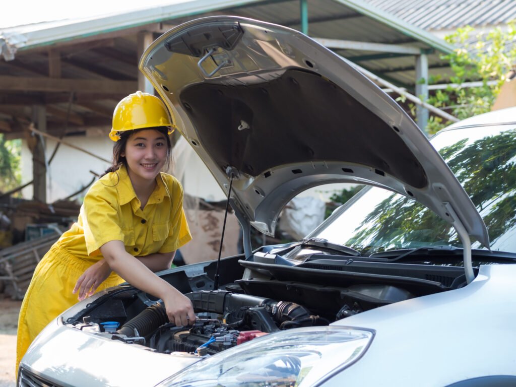 vecteezy the woman in the mechanic s work set is using a wrench to 7217838
