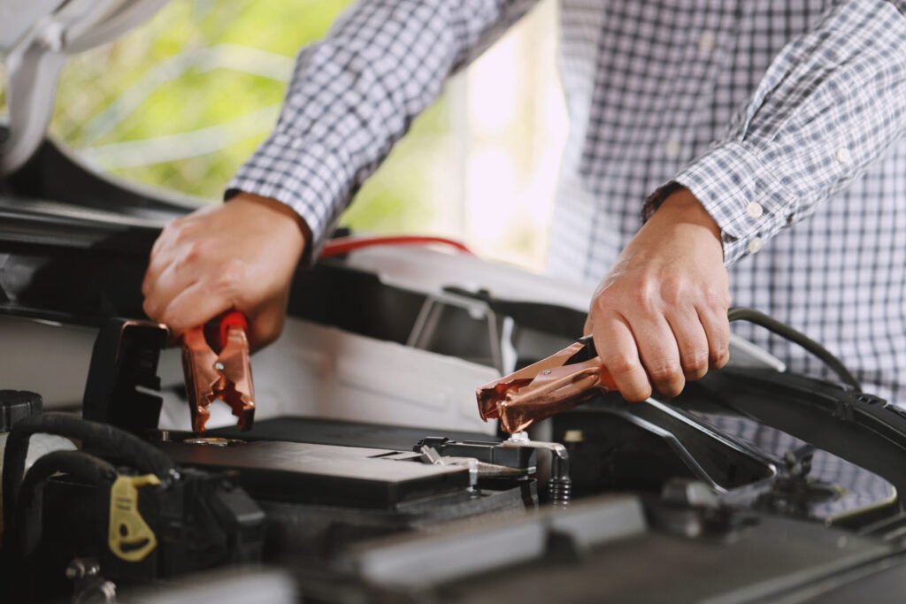 vecteezy a mechanic is charging car battery pot 11345570 1